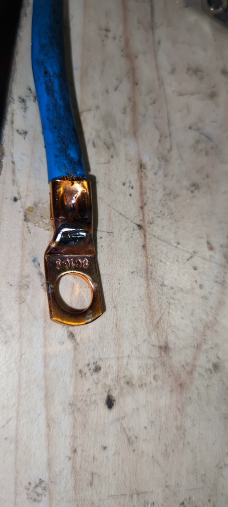 The wire is clamped and then soldered to a ring copper terminal. Wire is  pressed and then soldered.